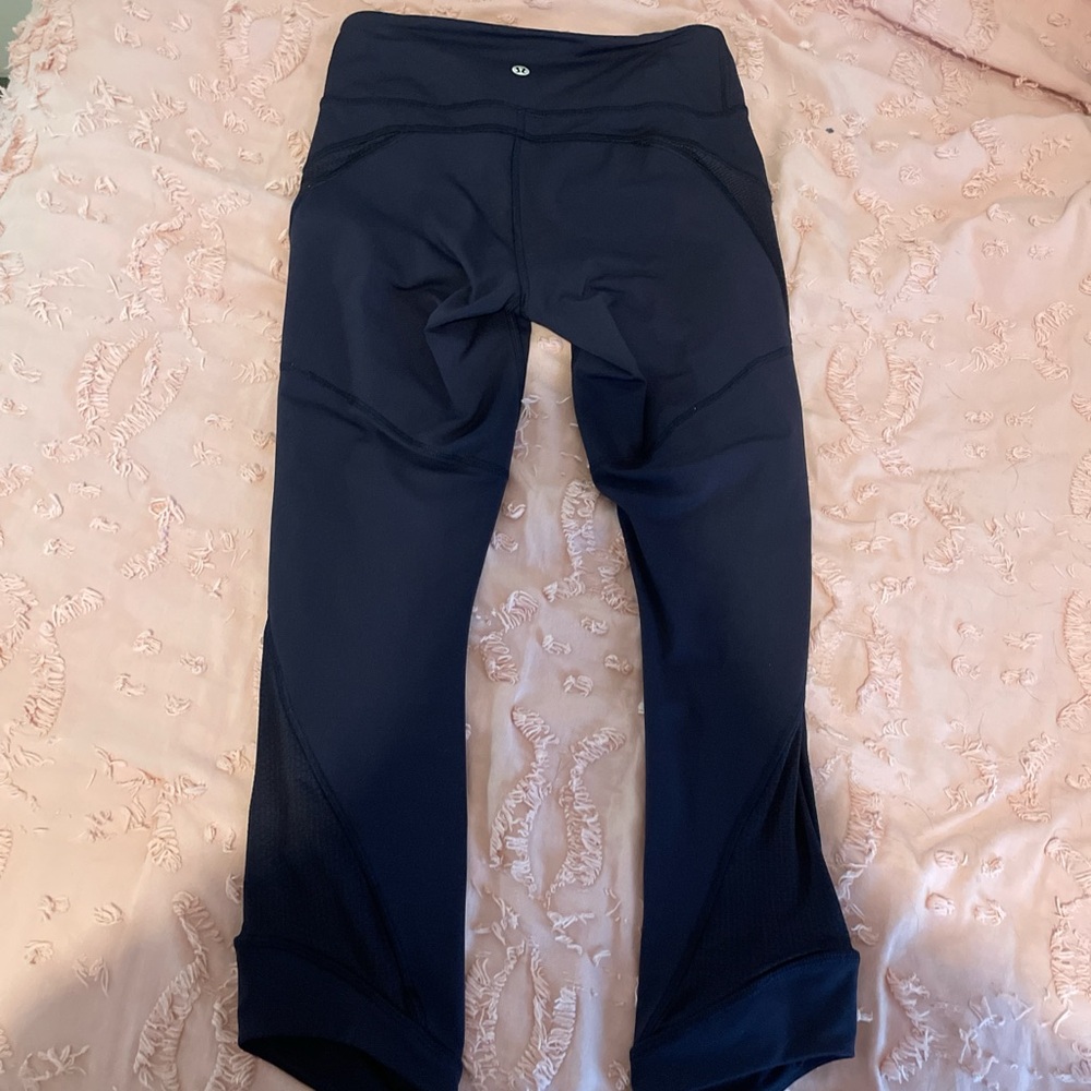 Rare lululemon black crop leggings size 4 with  cute detail on side - never worn